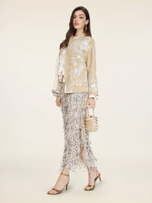 A woman stands against a plain light background wearing the Social Queen Floral Embroidered Velvet Jacket.