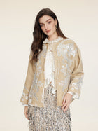 A woman models the Social Queen Floral Embroidered Velvet Jacket over a white blouse and silver sequin skirt, set against a plain light background.
