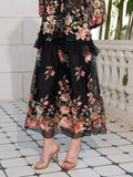 A person wears the Social Queen Floral Embroidery 100% Mulberry Silk Tulle Skirt with gold heels, standing on a tiled floor beside a white balustrade.