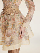 Wearing the Social Queen Floral Print Hand-Beaded Dress, a person stands with one arm at their side against a light background.