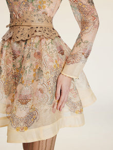 Wearing the Social Queen Floral Print Hand-Beaded Dress, a person stands with one arm at their side against a light background.