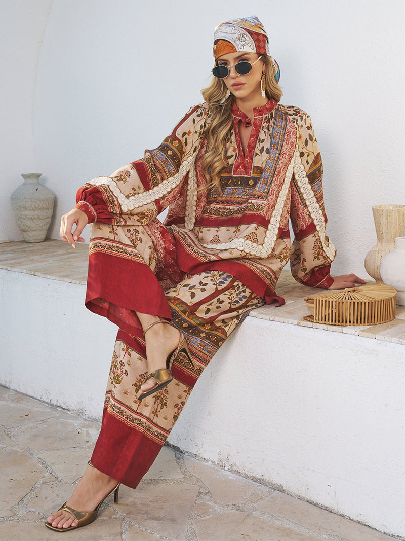 A woman wearing the Social Queen Floral Print Lace Boho Blouse sits gracefully on a ledge.