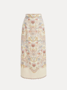 The Social Queen Floral Print Midi Skirt is a vintage-inspired, high-waisted cream linen midi skirt with an intricate floral and paisley pattern in soft pink, blue, and yellow tones.
