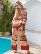 A woman by a pool wears Social Queen’s Floral Print Wide-Leg Boho Pants, paired with sunglasses, a bamboo bag, and a headscarf.