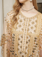 A woman wearing the Social Queen Gold Sequin Beaded Tulle Cape Dress, styled with a pearl choker and dangling earrings—an elegant choice for a wedding guest.