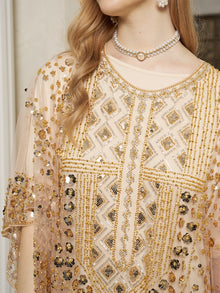 A woman wearing the Social Queen Gold Sequin Beaded Tulle Cape Dress, styled with a pearl choker and dangling earrings—an elegant choice for a wedding guest.