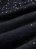 Close-up of Social Queen’s Gradient Rhinestone Wide-Leg Pants, showcasing their textured black fabric with small, shiny silver studs scattered throughout.