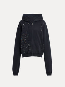 The Social Queen Hand-Applied Rhinestone Washed Hoodie is a relaxed black zip-up with a hood, side pockets, and multicolored hand-applied rhinestones scattered across the chest and sleeves.