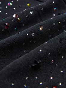 Close-up of the Social Queen Hand-Applied Rhinestone Washed Hoodie featuring black fabric adorned with multicolored hand-applied rhinestones and beads for unique detailing.