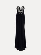 The Social Queen Hand-Applied Silver Crystal Baroque Velvet Gown is a strapless, fitted evening dress with hand-beaded silver crystal swirl details on the chest and a floor-length skirt.