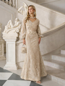 A woman in the Social Queen Hand-Beaded Lace Mermaid Dress stands on marble steps, holding a matching purse, with classical statues and architectural details behind her.
