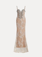The Social Queen Hand-Beaded Sequin Embroidered Cocktail Gown features a sleeveless, floor-length nude design with silver embellishments, a deep V-neckline, and intricate beaded details throughout.