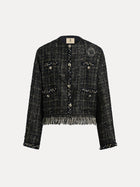 The Social Queen Hand-Beaded Tweed Fringe Jacket features front buttons, four pockets, embellished trim, fringe at the hem, and a cropped silhouette in chic black-and-gold.