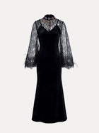 The Social Queen Hand-Sewn Crystal Velvet Feather Mermaid Gown features black velvet, sheer lace bell sleeves, a high collar, jeweled neckline embellishments, and elegant lace details.