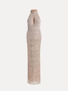 The Social Queen Hand-Sewn Pearl & Sequin Halter Gown features a sleeveless, floor-length mermaid silhouette with a keyhole front and intricate nude and silver embellishments.