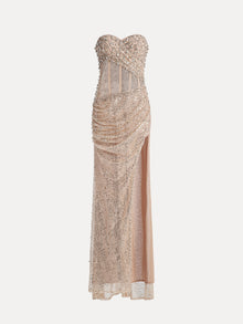 The Social Queen Hand-Sewn Radiant Crystal Mesh Pleated Gown boasts a strapless sequin design with a sheer corset bodice, ruched details, and thigh-high slit—ideal as an evening dress for any formal event.