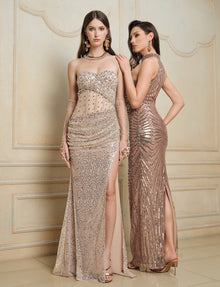 Two women pose indoors in Social Queen Hand-Sewn Radiant Crystal Mesh Pleated Gowns, featuring metallic patterns and high slits, standing against a beige decorative wall.