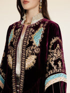 A person wears the Social Queen Handcrafted Embroidered Velvet Jacket over a white shirt, styled with a jeweled necklace, earrings, and vintage-inspired touches.