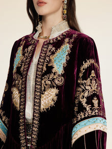A person wears the Social Queen Handcrafted Embroidered Velvet Jacket over a white shirt, styled with a jeweled necklace, earrings, and vintage-inspired touches.