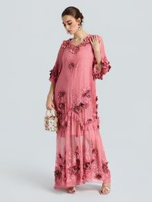 A woman in the Social Queen Rose Appliqué 100% Mulberry Silk Dress with an A-line silhouette holds a small floral handbag, standing against a plain light background.