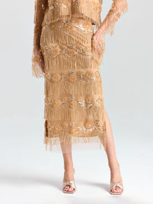Model wears the Social Queen Beaded Fringe Slit Midi Skirt with a matching sequined top and open-toe heels, posed against a plain background.