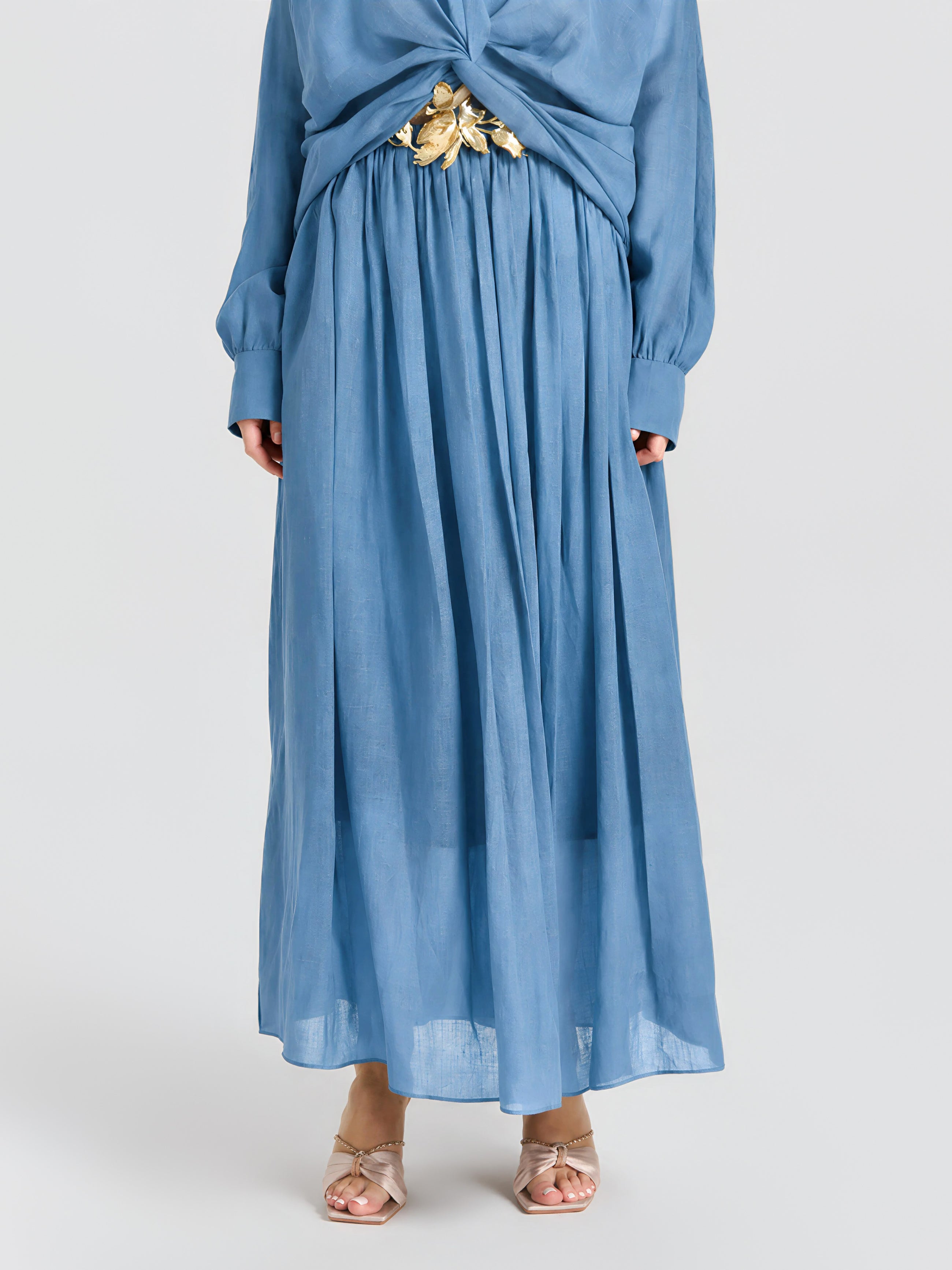 Person wearing the Social Queen Pleated Ramie Maxi Skirt (belt not included), styled with open-toe heeled sandals.