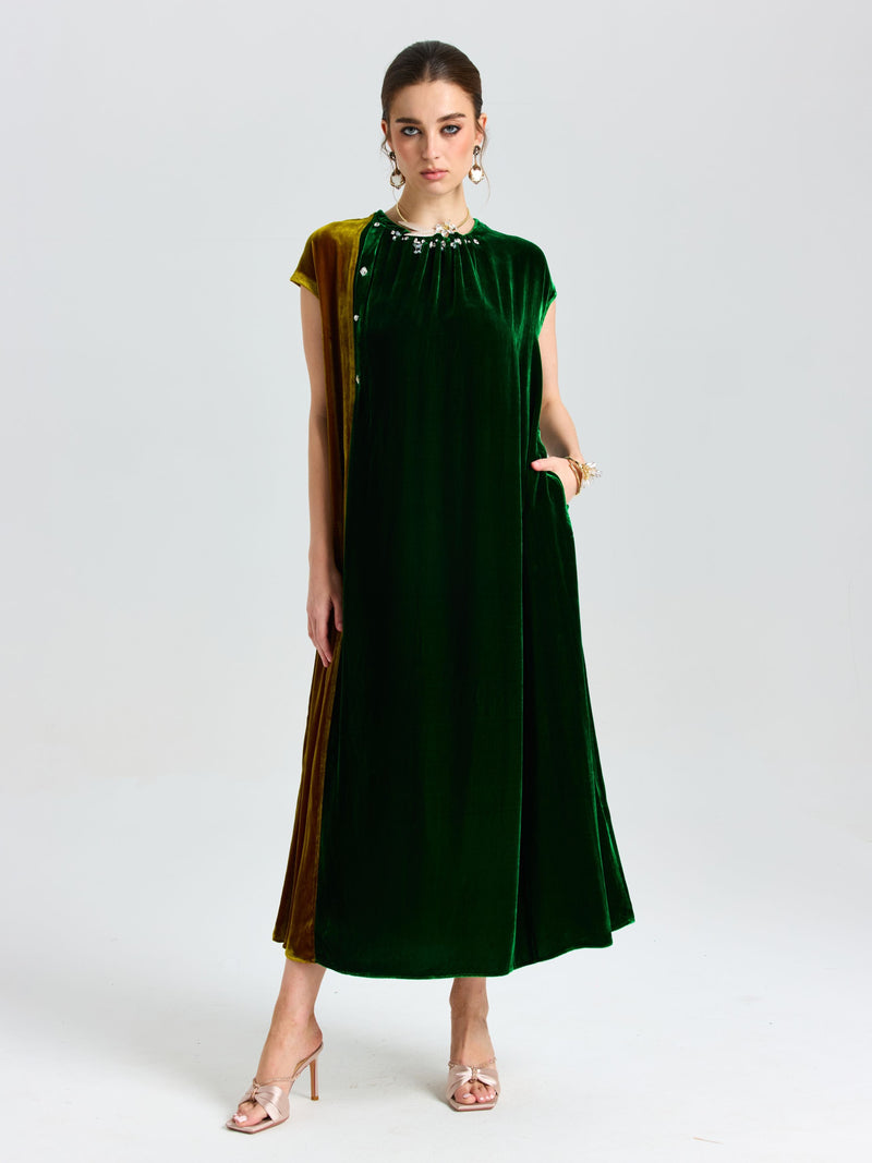 A woman wearing the Social Queen Colorblock Silk Velvet Shift Dress with cap sleeves and a beaded neckline, paired with open-toe heels, stands against a plain white background.