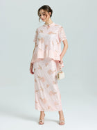 A woman wears the Social Queen Dragonfly Beaded Lace Top with a matching long skirt, standing against a plain background, holding a small purse and wearing heeled sandals.
