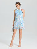 A woman in the Social Queen Embellished Floral Lace Mini Dress stands with a small handbag, looking down against a plain light background.