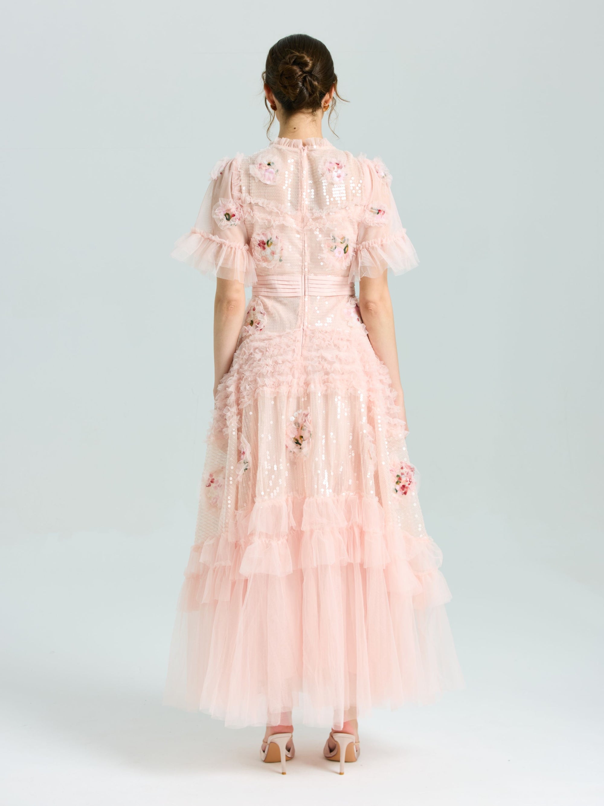 A woman in the Social Queen Embroidered Ruffle Tiered Tulle Dress stands in heels against a plain light background—the perfect special occasion look.