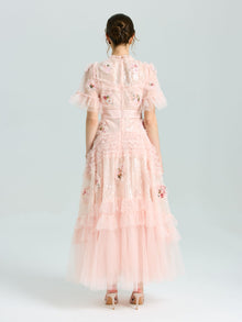 A woman in the Social Queen Embroidered Ruffle Tiered Tulle Dress stands in heels against a plain light background—the perfect special occasion look.