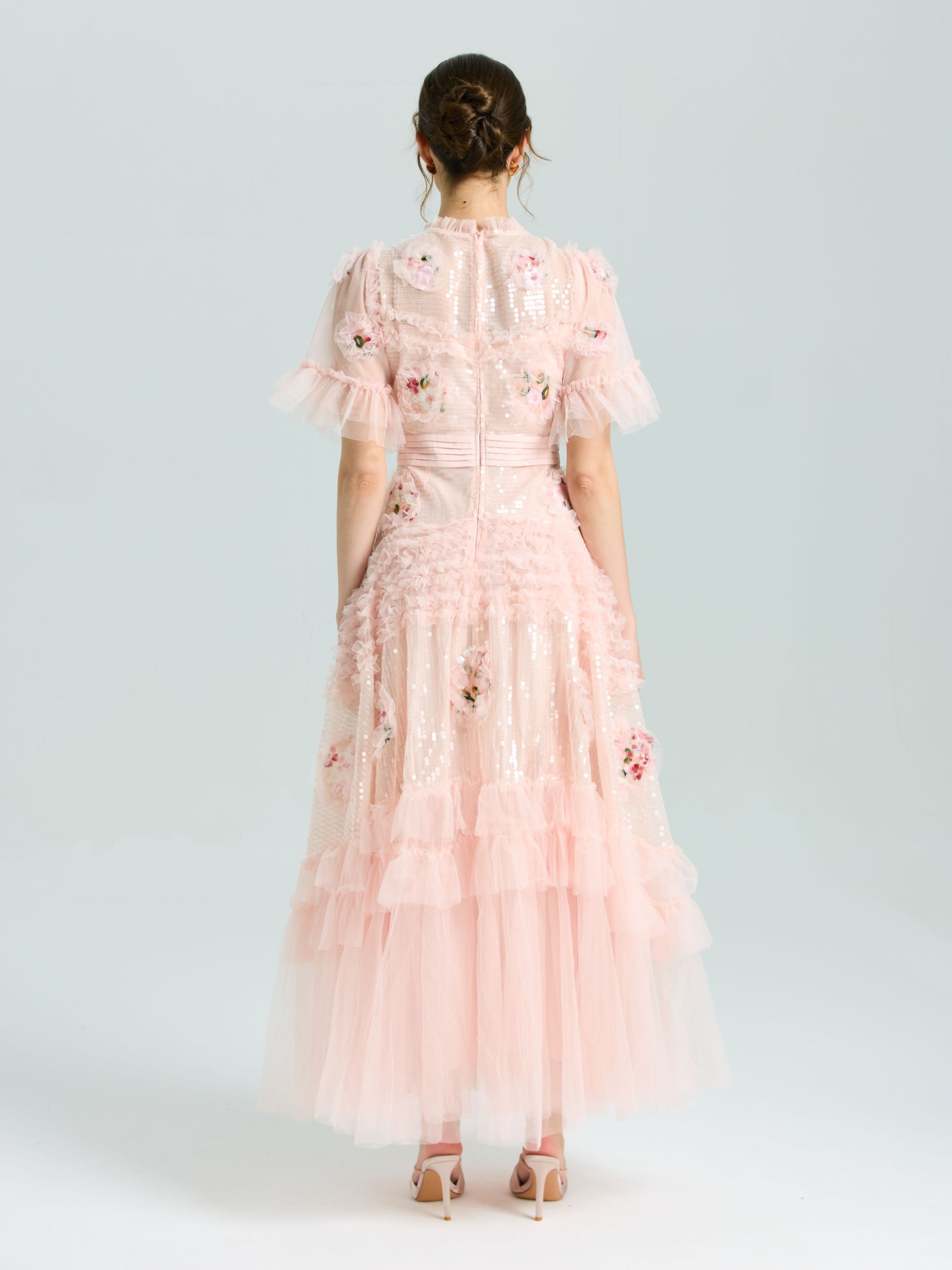 A woman in the Social Queen Embroidered Ruffle Tiered Tulle Dress stands in heels against a plain light background—the perfect special occasion look.