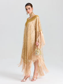 A woman models the Social Queen Beaded Fringe Cape Dress with matching heels and a beaded handbag, standing against a plain white background.