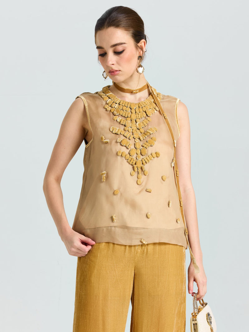 A woman in the Social Queen Velvet Scarf Silk Organza Top (Cami Included), paired with matching loose pants and a small beige purse, stands against a plain light background.