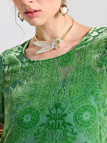 A woman wears the Social Queen Floral Silk Velvet Shift Dress (cami included), styled with a gold necklace featuring a white flower pendant and leaf accents.
