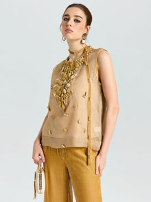 A woman wears the Social Queen Velvet Scarf Silk Organza Top (cami included), styled with gold wide-leg pants, statement jewelry, and a beige handbag against a plain background.