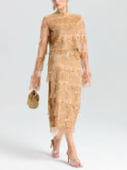 A person wearing the Social Queen Beaded Fringe Floral Top, styled with a gold beaded bag and open-toe heeled sandals.