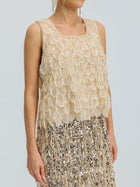 A person wearing the Social Queen 3D Leaf Beaded Mesh Top, a sleeveless style with layered scallop details, paired with a sequined fringe skirt, shown from shoulders to mid-thigh.