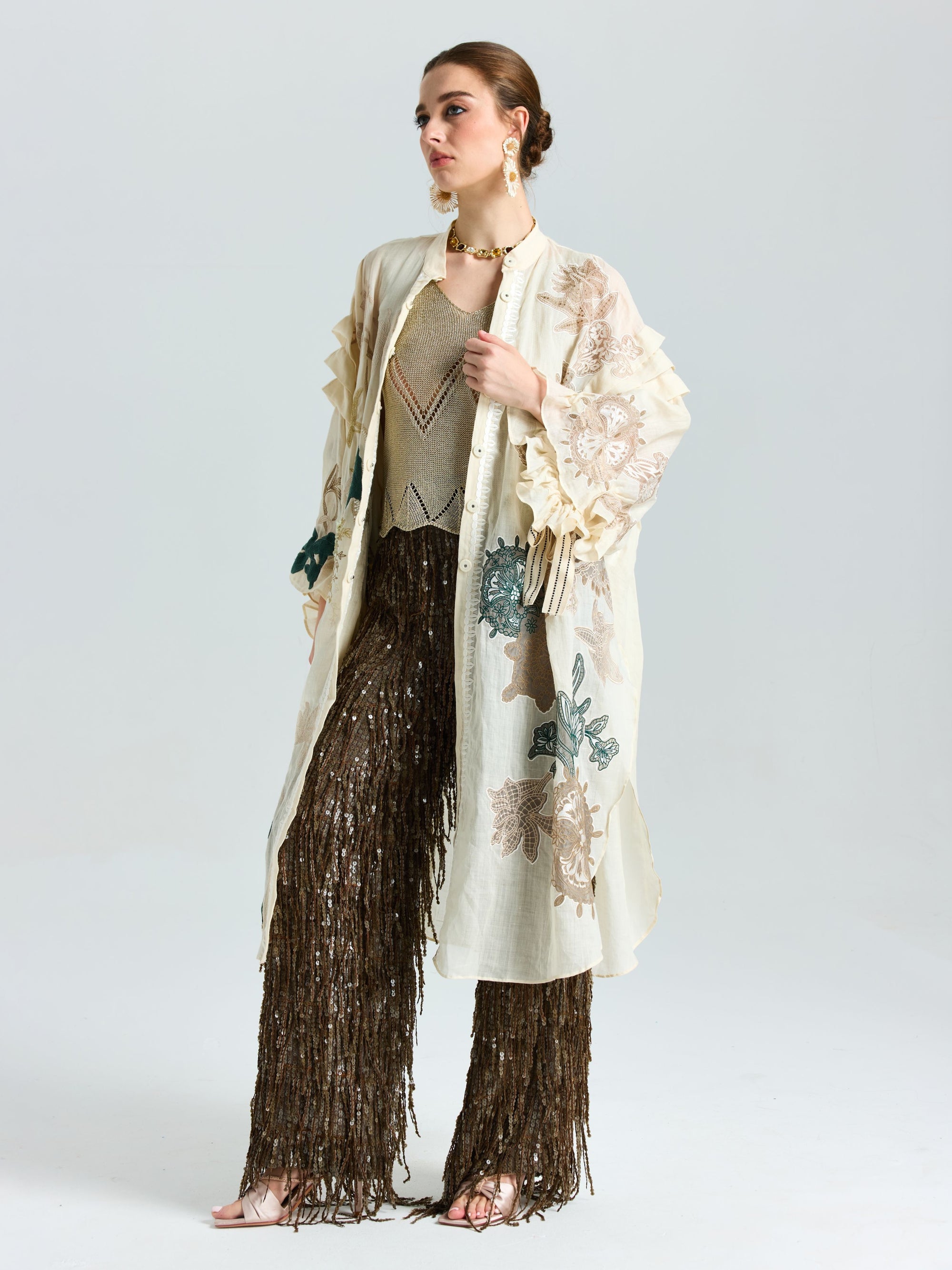 A woman wears the Social Queen Floral Embroidered Linen Jacket (Cami Included), styled with brown fringed pants, against a plain white background.