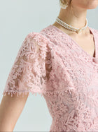 Close-up of a person wearing the Social Queen Floral Embroidered Lace Dress featuring pink lace, short sleeves, beaded details, and a double pearl necklace.
