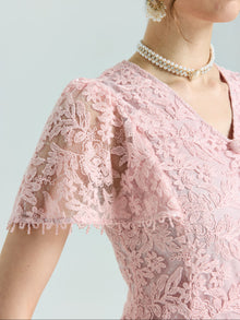 Close-up of a person wearing the Social Queen Floral Embroidered Lace Dress featuring pink lace, short sleeves, beaded details, and a double pearl necklace.
