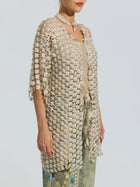 A woman styles the Social Queen Pearl Daisy Cutwork Long Cardigan (camisole not included)—a sheer, knee-length layer—with a beige top, faded jeans, and a pearl necklace.