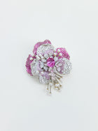The Social Queen Gradient Peony Rhinestone Brooch, shaped like a flower and adorned with pink and white gemstones along with pearl accents, is displayed against a plain white background.