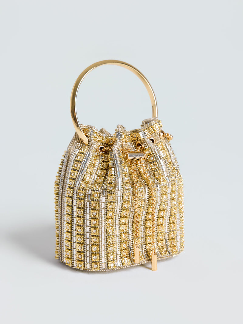 The Social Queen Rhinestone Bucket Bag is a small gold and silver beaded evening bag with rhinestone accents, a metallic handle, geometric patterns, and drawstring closure—an embellished accessory ideal for special occasions.
