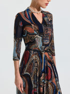 A woman models the Social Queen Paisley Print Knit Dress (Belt Included), featuring three-quarter sleeves, shown from shoulders to knees against a plain background.