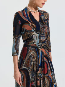 A woman models the Social Queen Paisley Print Knit Dress (Belt Included), featuring three-quarter sleeves, shown from shoulders to knees against a plain background.