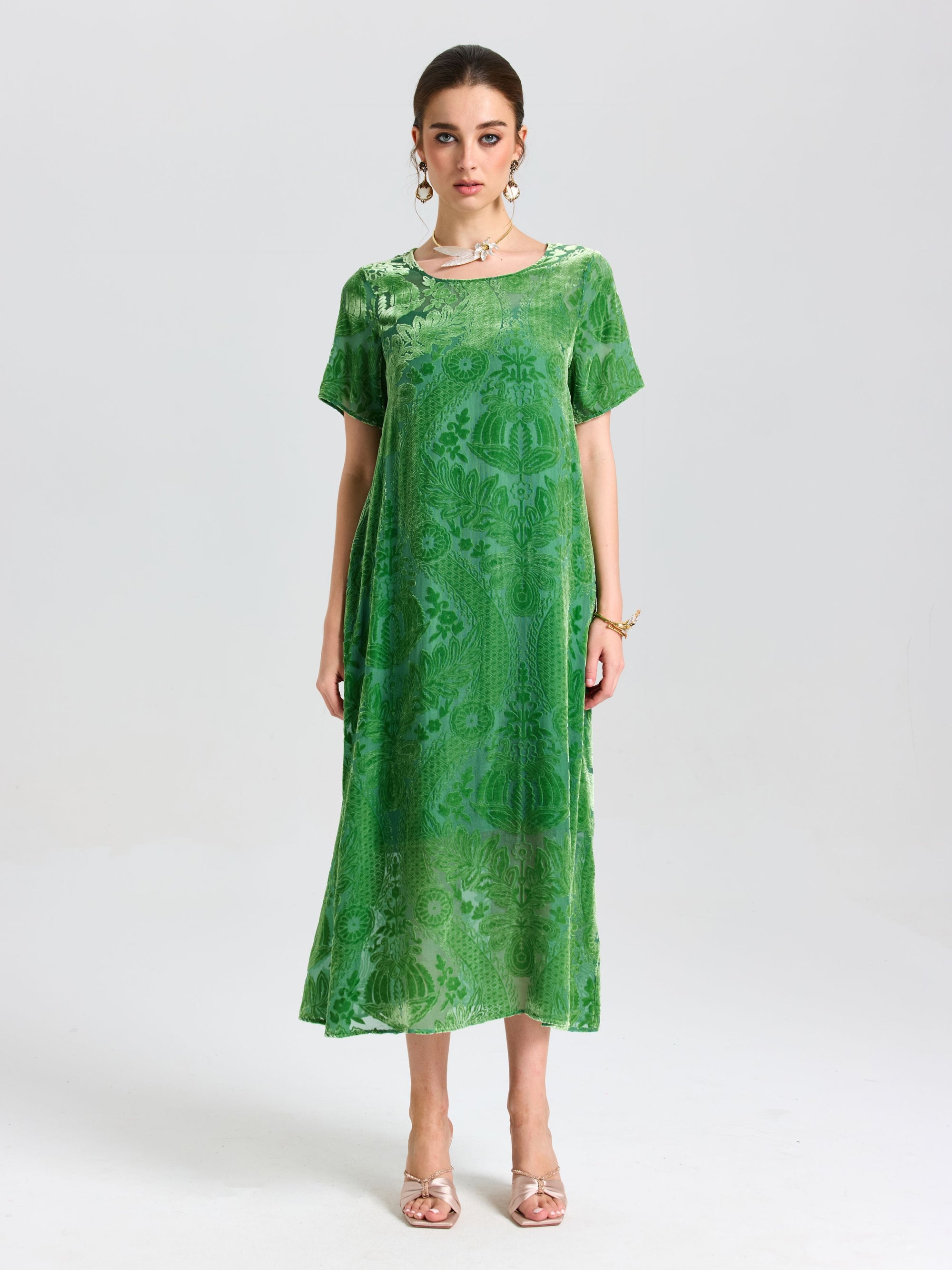 A woman faces forward against a plain light background, wearing the Social Queen Floral Silk Velvet Shift Dress (Cami Included), styled with sandals and jewelry.