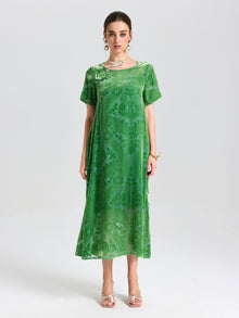 A woman faces forward against a plain light background, wearing the Social Queen Floral Silk Velvet Shift Dress (Cami Included), styled with sandals and jewelry.