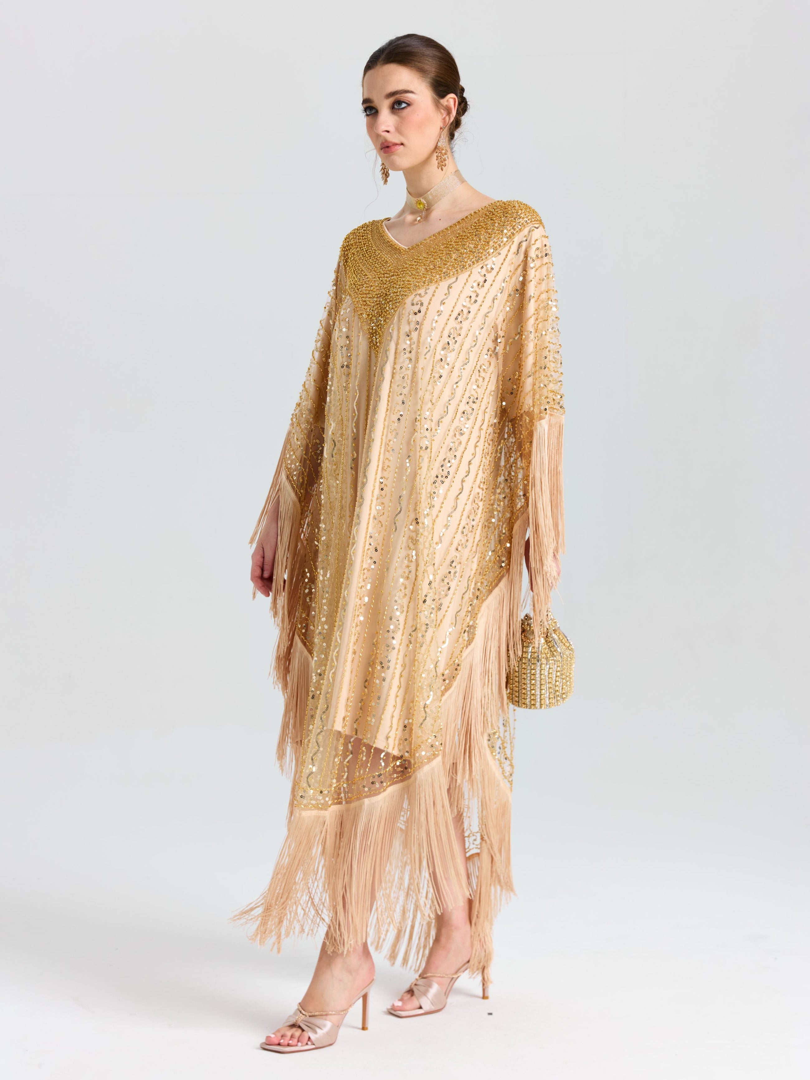 A woman models the Social Queen Beaded Fringe Cape Dress with a matching handbag, standing against a plain white background.