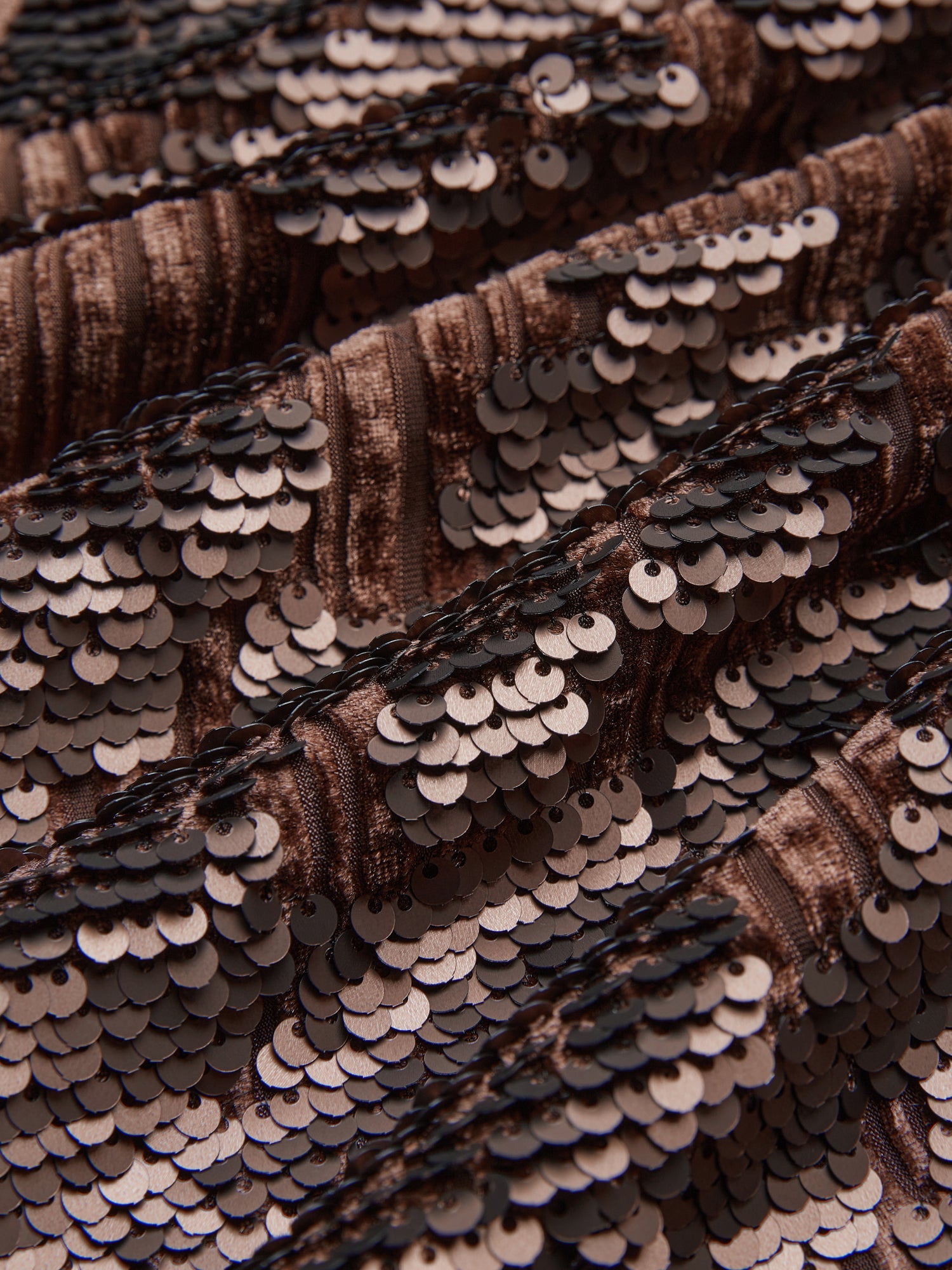 Close-up of bronze and brown ombré sequins arranged in textured horizontal rows on the Social Queen Ombre Sequin Velvet Skirt—an elegant, detailed piece perfect for adding a glamorous touch.